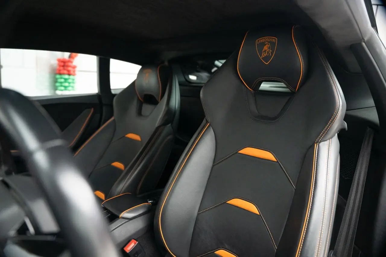 Rent a 2023 Lamborghini Huracan EVO Black in Dubai photo 2