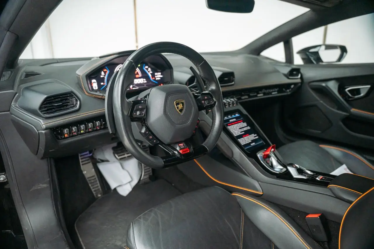 Rent a 2023 Lamborghini Huracan EVO Black in Dubai photo 4