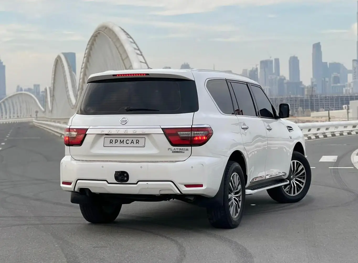 Hire 2025 Nissan Patrol Platinum White in Dubai photo 2