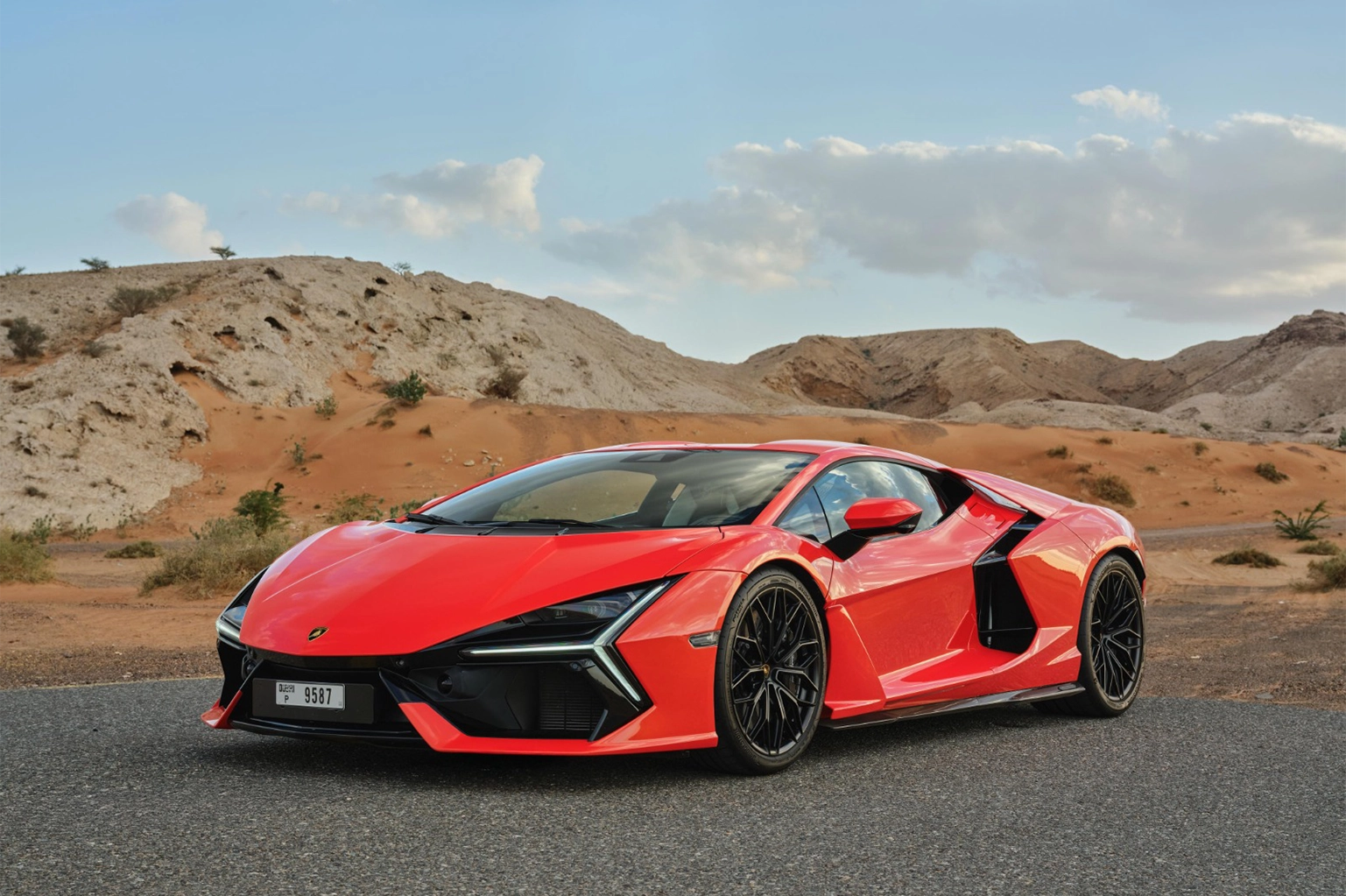 Rent a Lamborghini Revuelto Orange in Dubai photo 2