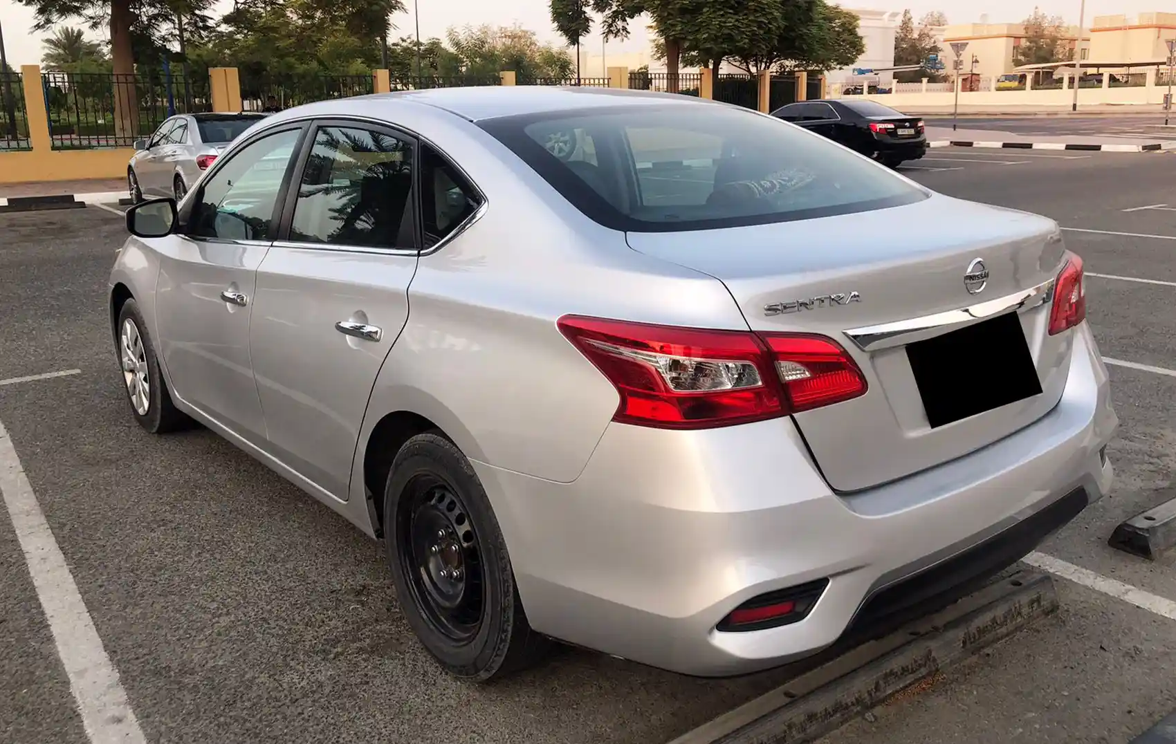 2026 Nissan Sentra Silver Rental in Dubai photo 2