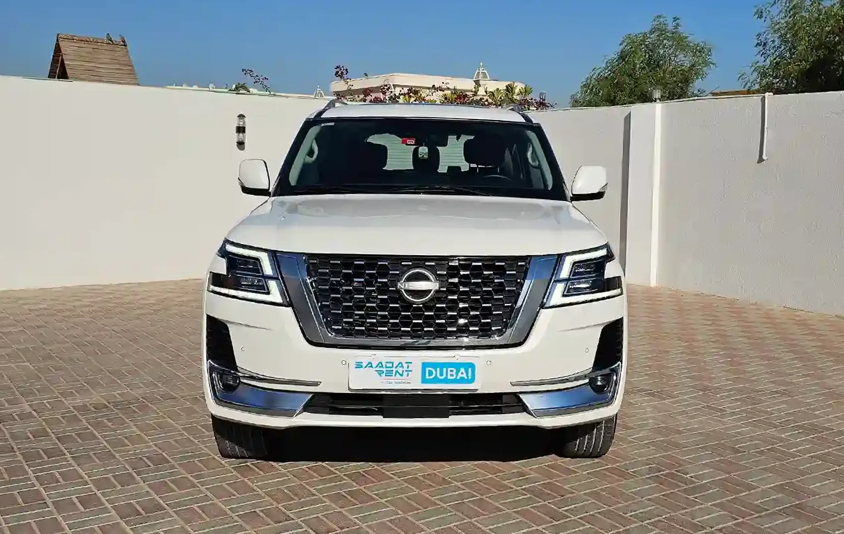 Rent 2023 Nissan Patrol White in Abu Dhabi photo 2