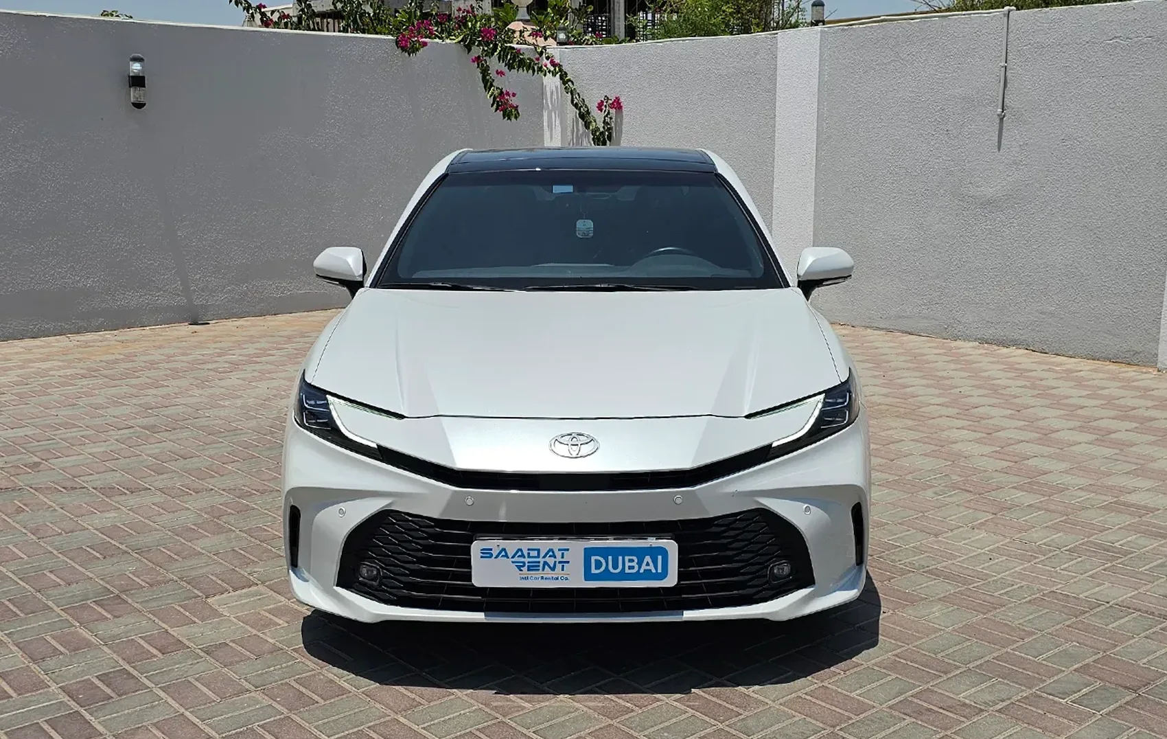 Rent a 2025 Toyota Camry Hybrid White in Abu Dhabi