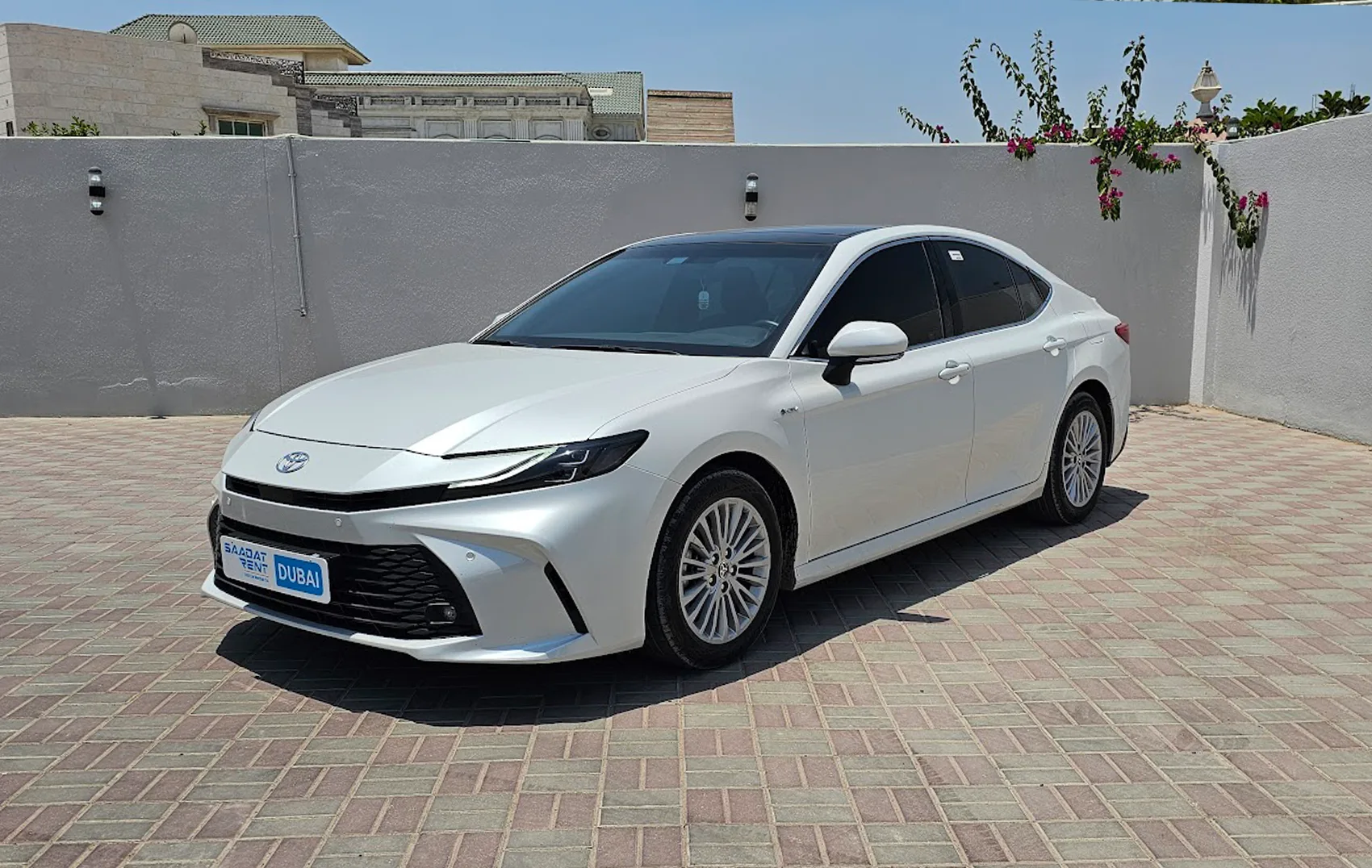 Rent a 2025 Toyota Camry Hybrid White in Abu Dhabi photo 2