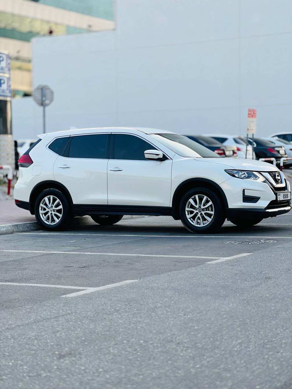 Rent a 2021 Nissan X-Trail White in Dubai rental in Sheikh Zayed Road, Dubai