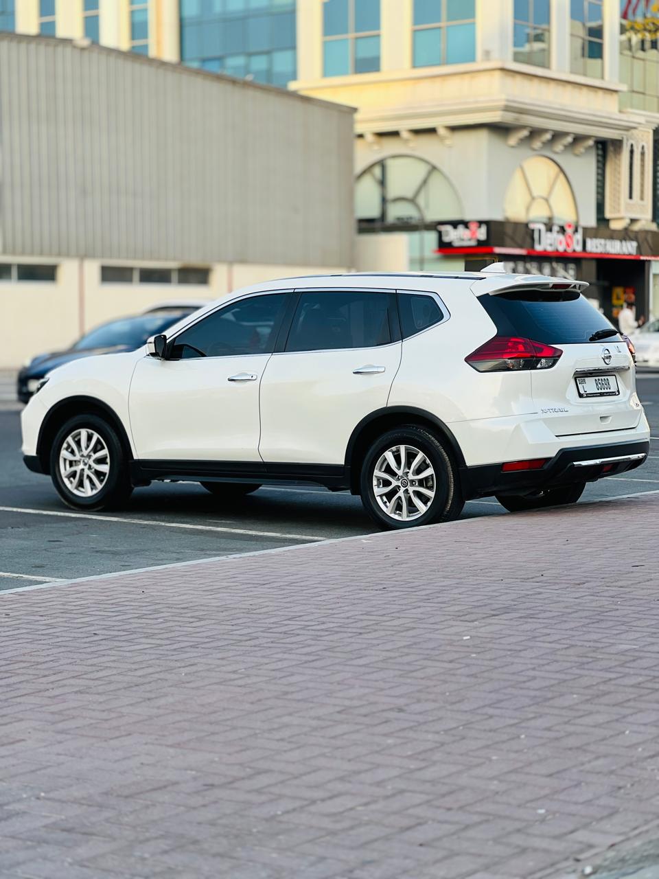 Rent a 2021 Nissan X-Trail White in Dubai photo 4